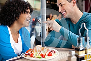 Cheerful couple in restaurant