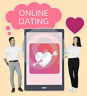 Cheerful couple showing online dating on a tablet