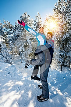 Cheerful couple on ski vacation at mountain