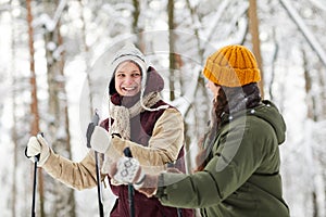 Cheerful Couple Skiing in Forest