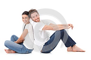 Cheerful couple smiling happily on floor photo