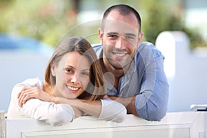 Cheerful couple standing in the yard