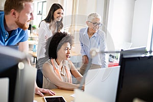 Cheerful coworkers in office during company meeting