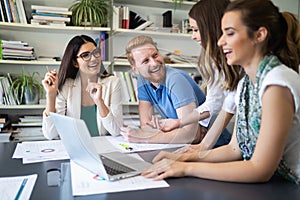 Cheerful coworkers in office during company meeting