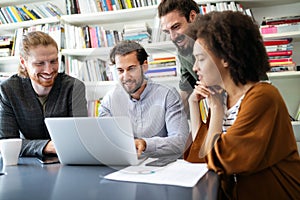 Cheerful coworkers in office during company meeting