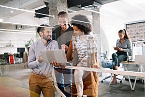 Cheerful coworkers in office during company meeting