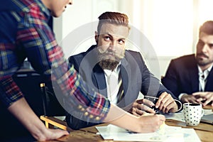 Cheerful coworkers in office during company meeting