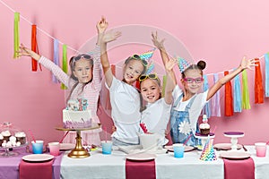 Cheerful crazy kids celebrating birthday party