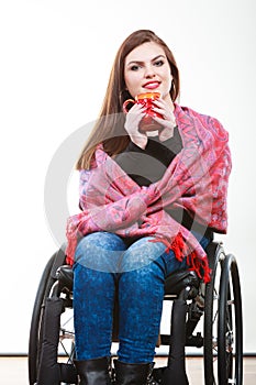 Cheerful crippled lady on wheelchair