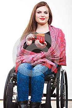 Cheerful crippled lady on wheelchair.