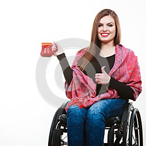 Cheerful crippled lady on wheelchair.