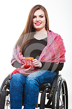 Cheerful crippled lady on wheelchair.