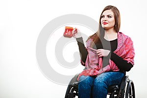 Cheerful crippled lady on wheelchair.