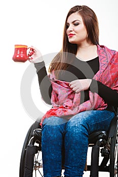 Cheerful crippled lady on wheelchair.