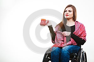 Cheerful crippled lady on wheelchair.