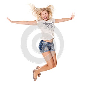 Cheerful dancing girl jumping short on white background flying hair