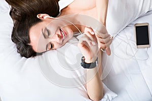 Cheerful delighted woman resting in bed