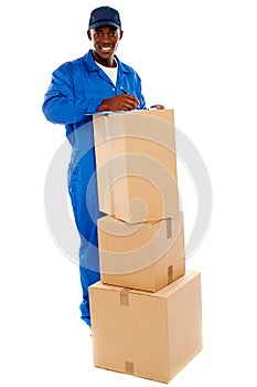 Cheerful delivery guy preparing receiving notice