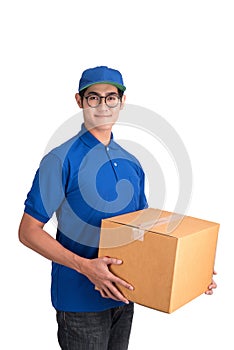 Cheerful delivery man. Happy young courier holding a cardboard box