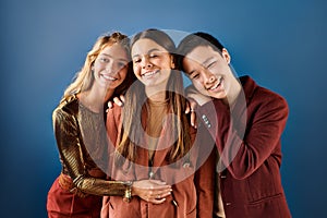 cheerful diverse adolescents in elegant outfits