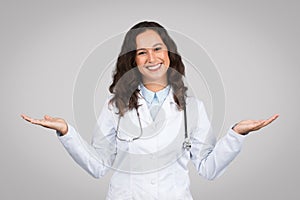 Cheerful doctor with arms outstretched, balancing hands
