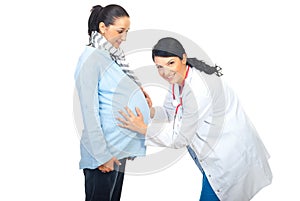 Cheerful doctor examine pregnant belly