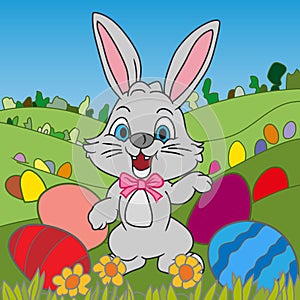 Cheerful Easter bunny with colorful Easter eggs in the fields