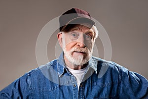 Cheerful elderly man looking with wonder