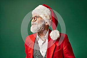 cheerful elegant Santa in christmassy hat