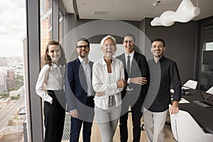 Cheerful excited business team office front portrait