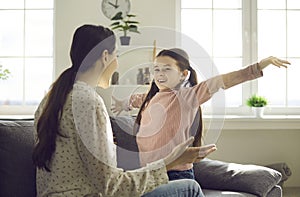 Cheerful excited daughter ready to hug loving mother family lifestyle portrait