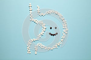 Cheerful face in stomach of pills. Healthy lifestyle, good digestion