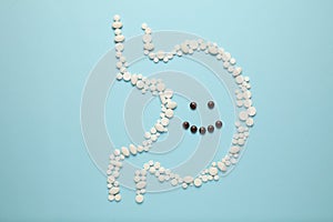 Cheerful face in stomach of pills. Healthy lifestyle, good digestion