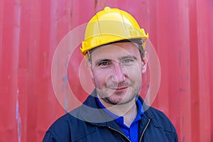 Cheerful factory worker man in hard hat smiling and looking at camera with joy, Happiness concept