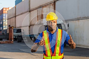 Cheerful factory worker man smiling with giving thumbs up as sign of Success