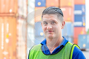 Cheerful factory worker man smiling and looking at camera with joy, Happiness concept