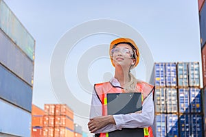 Cheerful factory worker woman in hard hat smiling and looking to the sky, Happiness Female engineers for concept