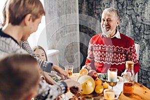 Cheerful family celebrating grandparent`s birthday