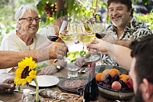 Cheerful family cheering with wine