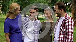 Cheerful family laughing, having fun together, spending leisure time, wellness