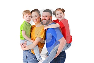 Cheerful family looking at camera in studio
