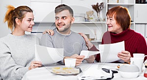 Cheerful family with papers
