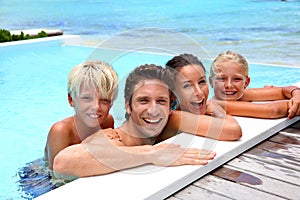 Cheerful family in water