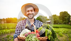 Cheerful farmer with organic vegetables photo