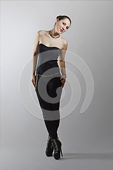 Cheerful fashionable woman in extremely high heels