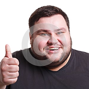 Cheerful fat man showing like, thumb-up gesture