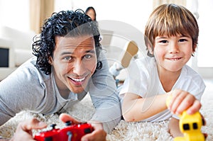 Cheerful father and his son playing video games