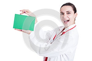 Cheerful female doctor with empty paper