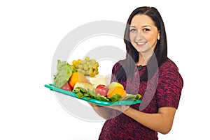 Cheerful female hold plateau with healthy food