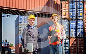 Cheerful female shipping company workers working at the harbor, Cheerful factory worker man smiling and holding laptop with cargo